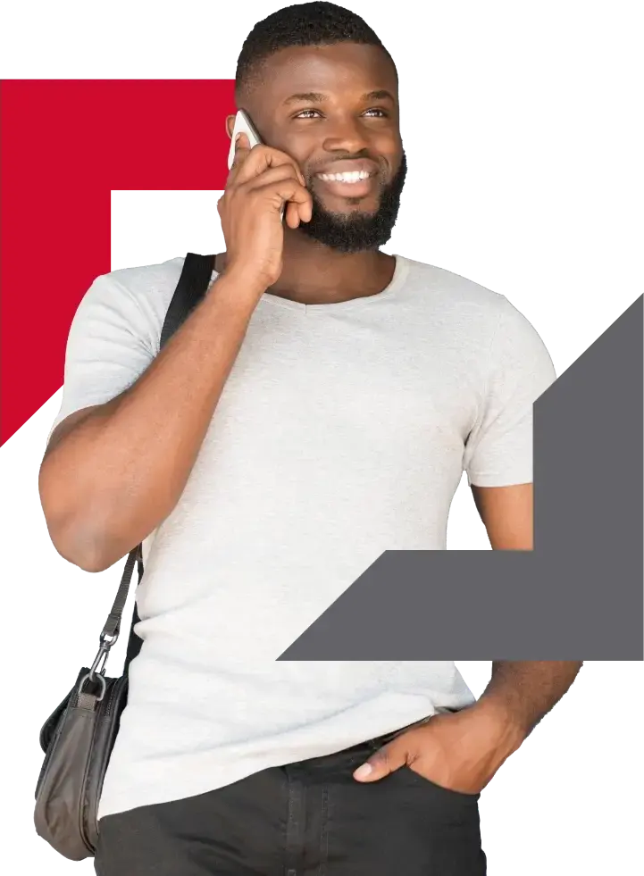 young man on phone carrying bag