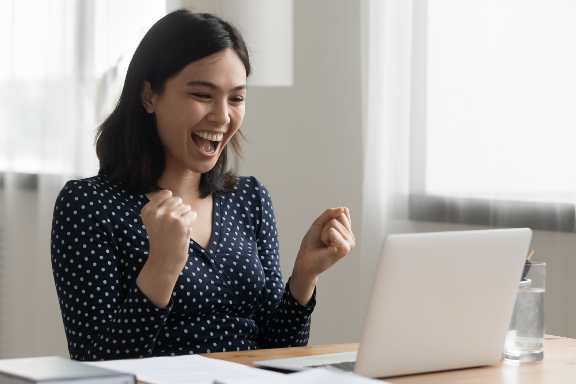 person on computer excited