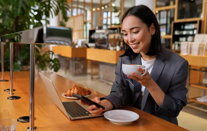 woman in gray suit at cafe